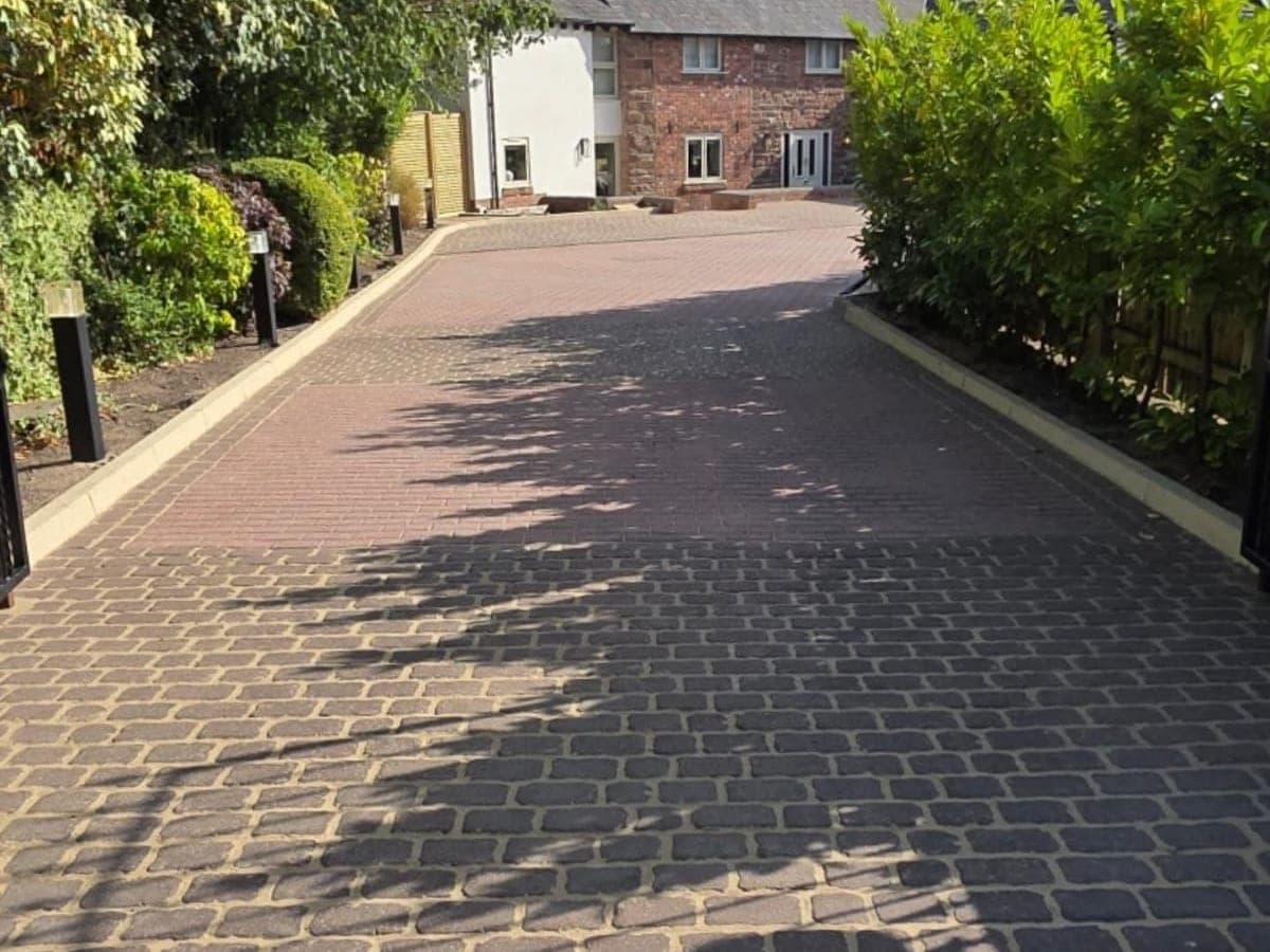 Leaf strewn block driveway at a barn conversion, and the same driveway cleaned