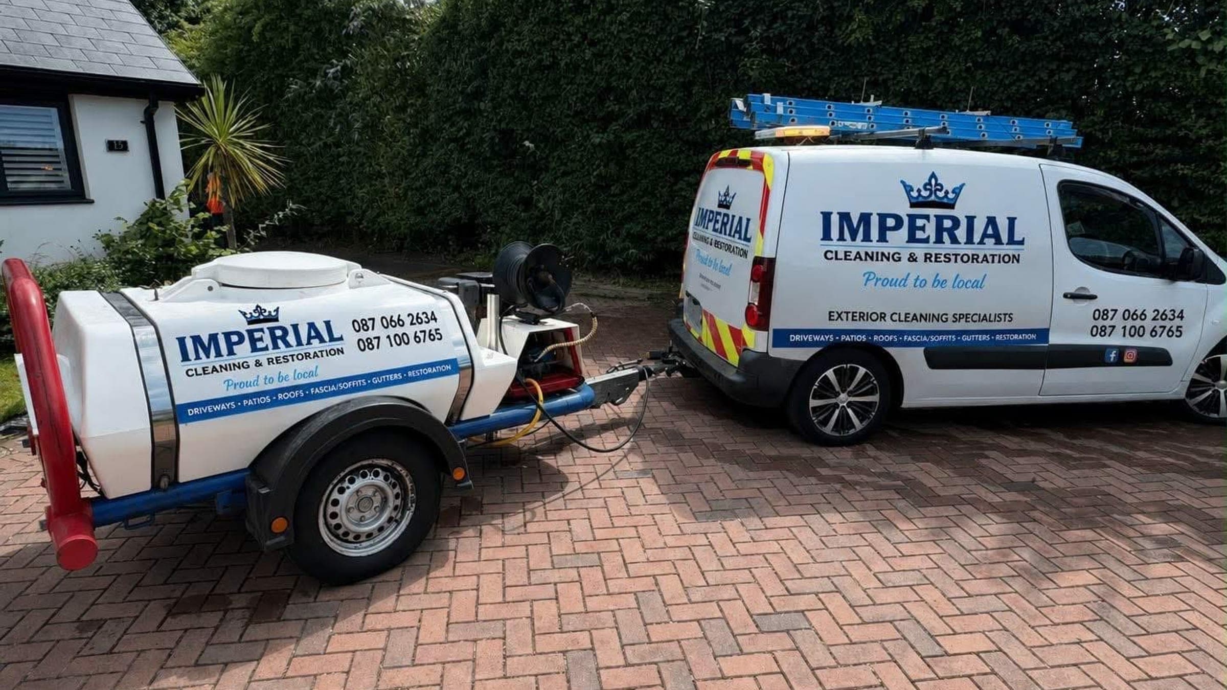 Imperial Cleaning and Restoration branded van and pressure washer trailer on a cleaned block paved driveway